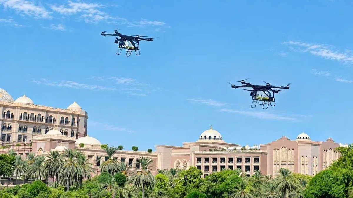Two ARIDGE aircraft flying in formation above the Emirates Palace in Abu Dhabi