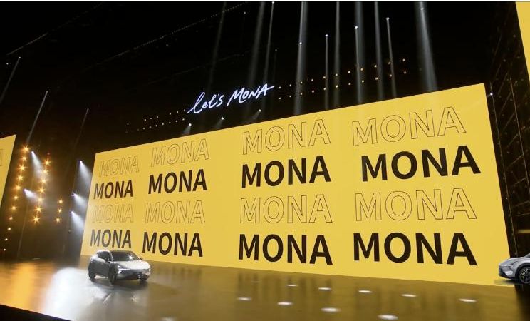 The MONA L05 drives onto the launch stage. XPeng's broadcast, 29 Oct 2026, 11:19 UTC.
